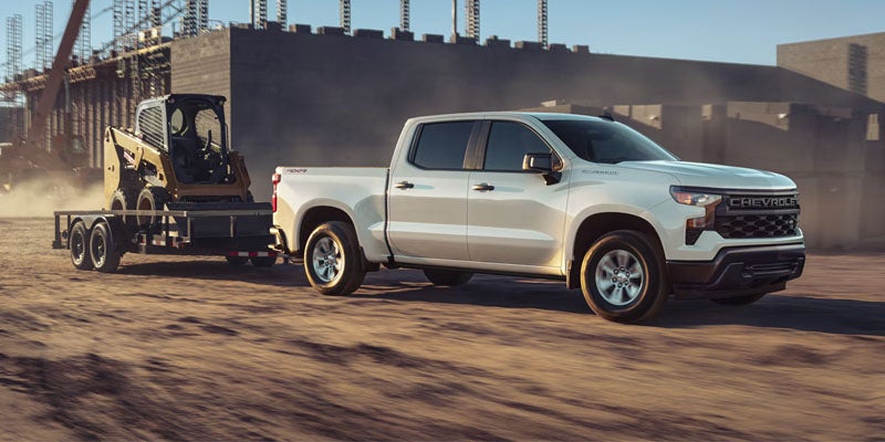 2026 Chevrolet Silverado 1500 driving near Wentzville MO on I-70 showing strong towing performance and 5.3L V8 capability