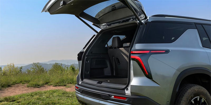 2026 Chevrolet Traverse rear cargo area with open trunk in Wentzville MO showing large storage space for luggage and gear